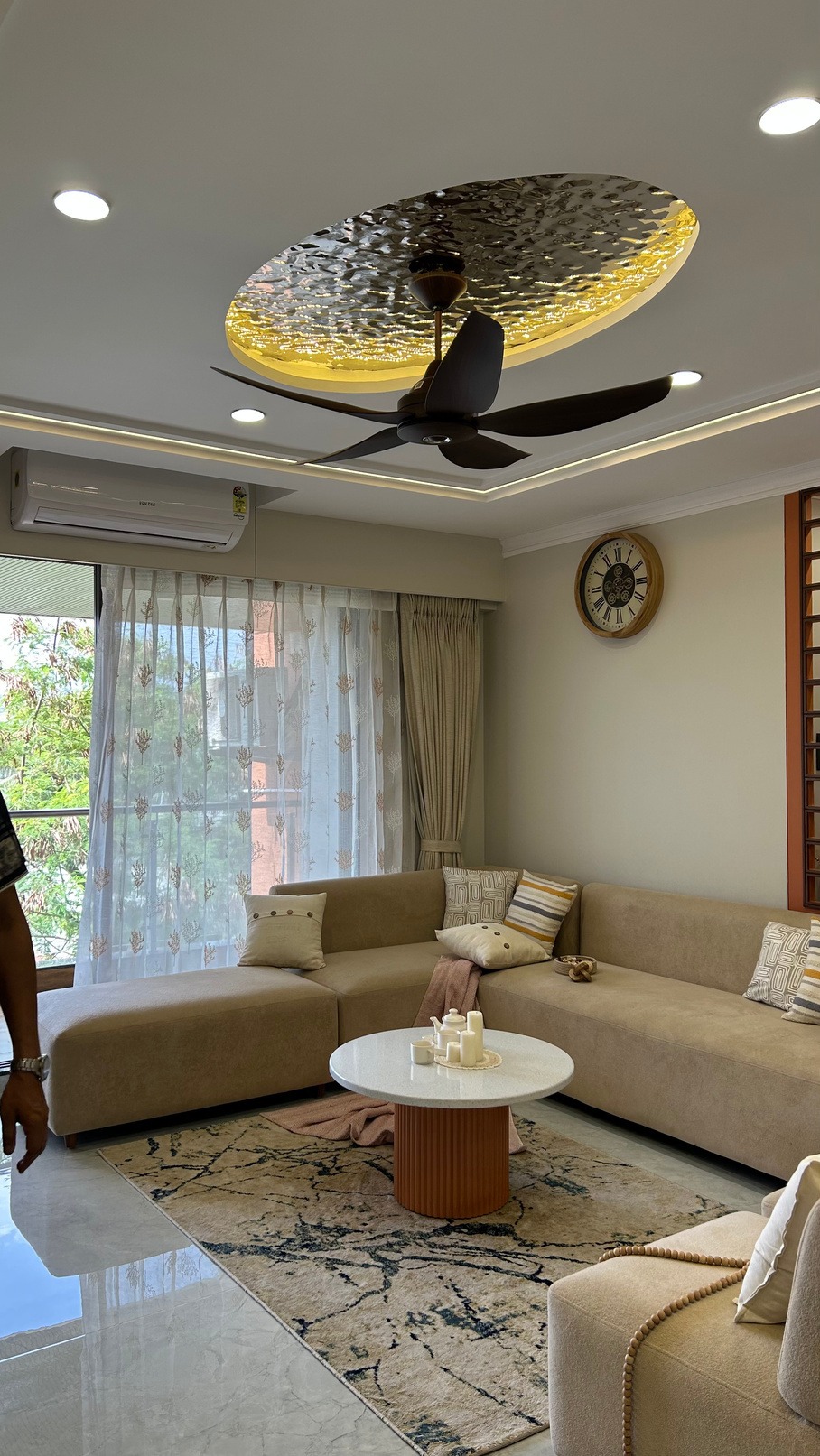 Hand-built teak jaali screen filtering daylight at Landmark Residence