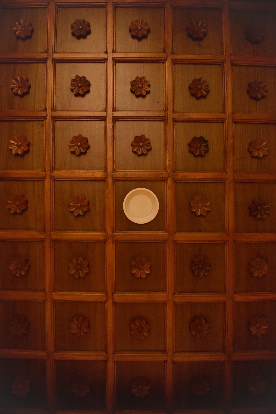 Carved teak ceiling panels at Siddhesh Bungalow